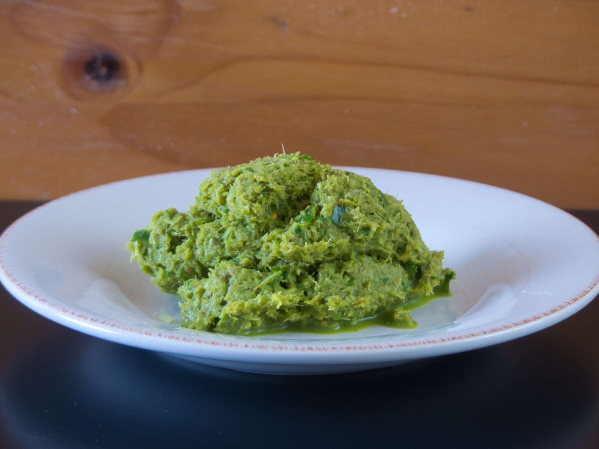 A vibrant, freshly ground Thai green curry paste, ready to be used in your favorite Thai dishes