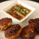 "Golden-brown Thai fish cakes served with a refreshing cucumber relish