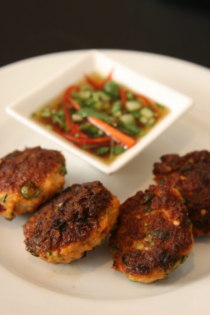 "Golden-brown Thai fish cakes served with a refreshing cucumber relish
