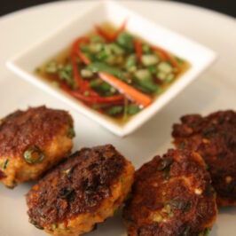 "Golden-brown Thai fish cakes served with a refreshing cucumber relish