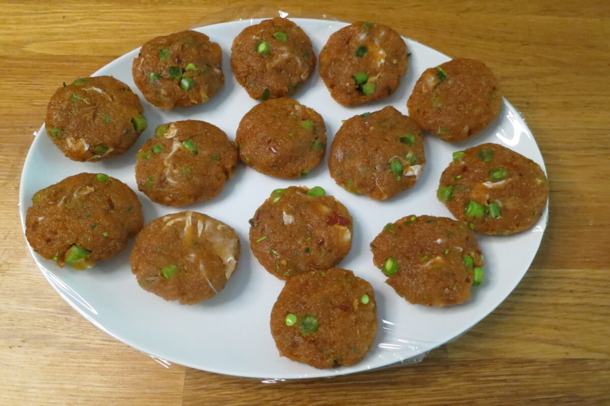 Prepared fish cakes ready to cook