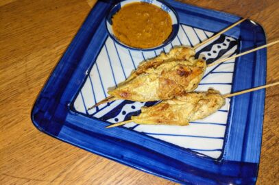 "Grilled Thai chicken satay skewers served with Homemade peanut sauce"