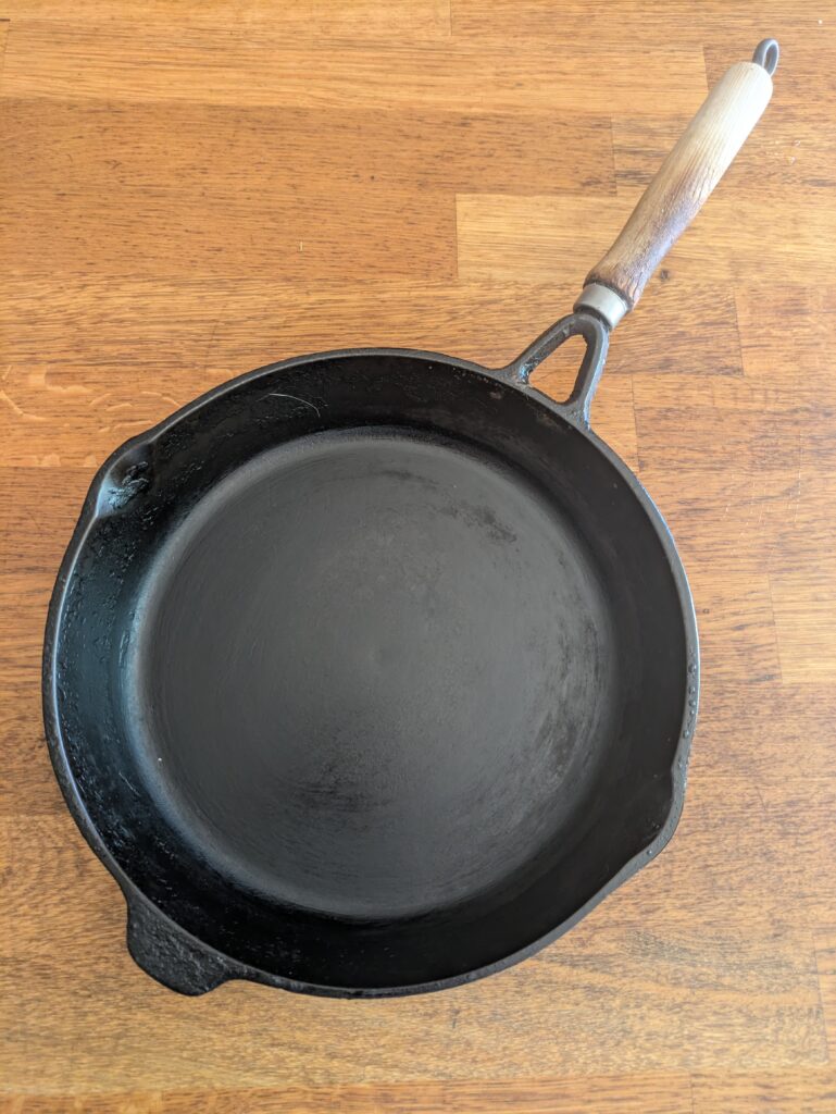 “Empty frying pan ready for cooking Thai corn fritters.”