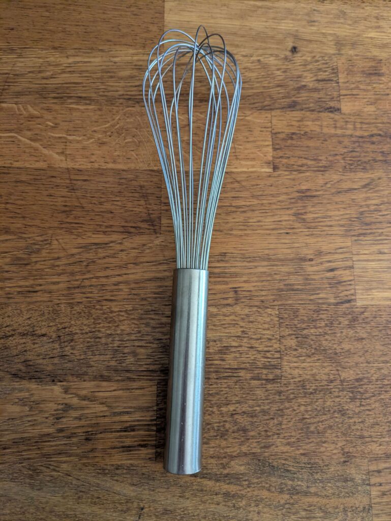 Whisk on a kitchen bench in a home kitchen