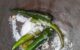 Green chilli and salt in a mortar to make Thai hot chilli lime dressing